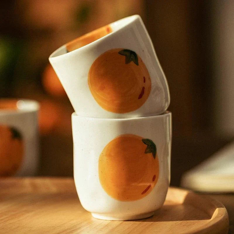 Teapot and Orange Cups