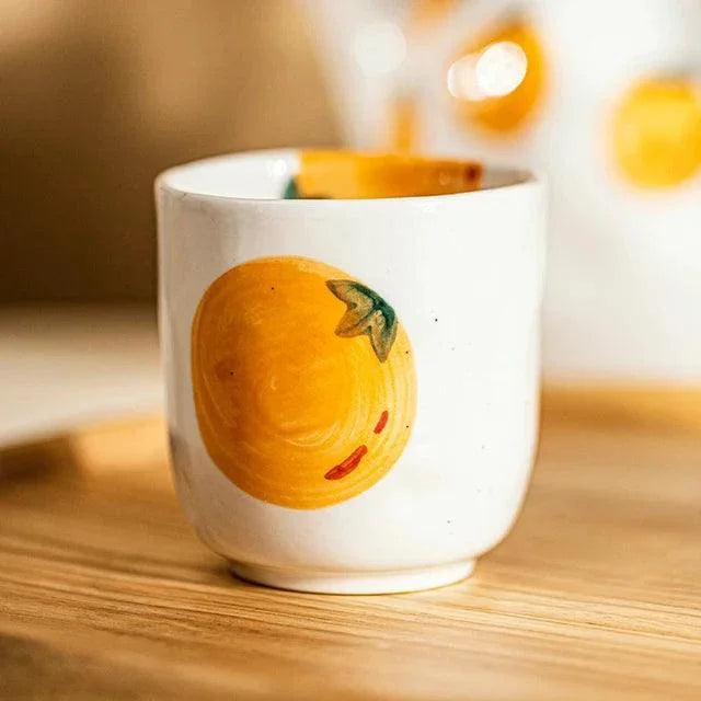 Teapot and Orange Cups