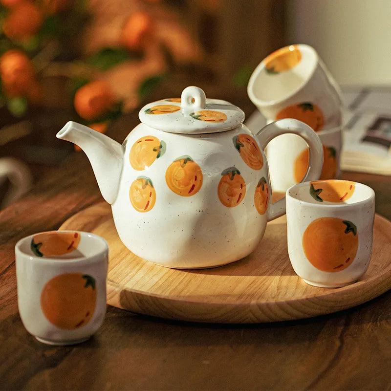 Teapot and Orange Cups