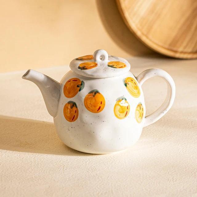 Teapot and Orange Cups