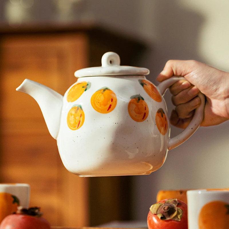 Teapot and Orange Cups